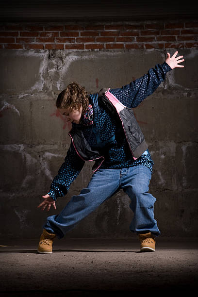 istock Hip hop dancer in modern style over brick wall 112815071