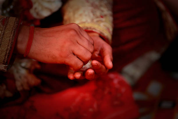 Young Indian groom sitting on sat fere on traditional Indian wedding ceremony.