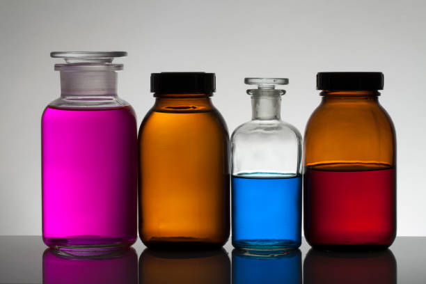 istock Liquid in laboratory bottles. Scientific biochemical laboratory. Colorful liquid. Isolated on white background,  a group of bottles. Test tubes. 1128155679