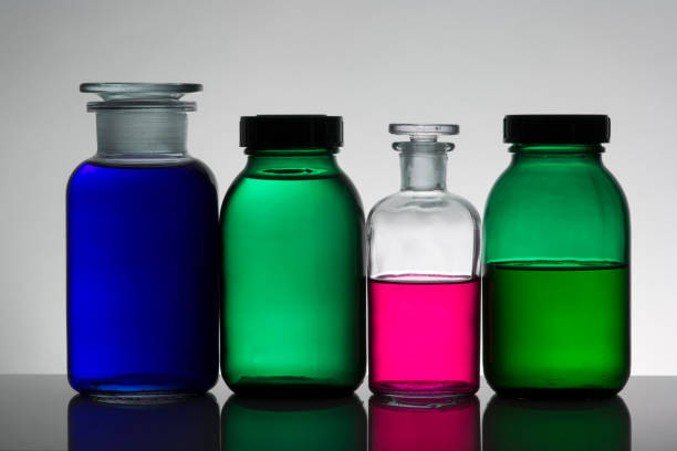 istock Liquid in laboratory bottles. Scientific biochemical laboratory. Colorful liquid. Isolated on white background,  a group of bottles. Test tubes. 1128155705