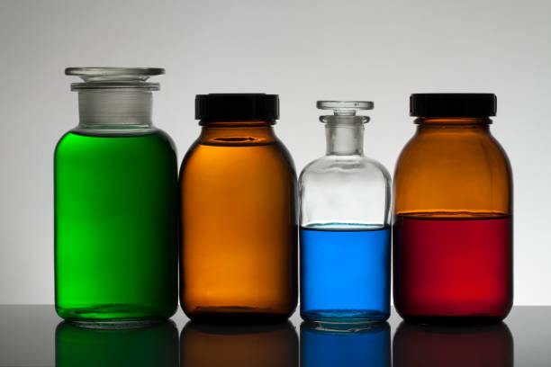 istock Liquid in laboratory bottles. Scientific biochemical laboratory. Colorful liquid. Isolated on white background,  a group of bottles. Test tubes. 1128155738