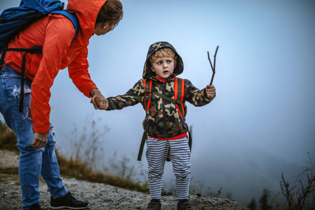 istock Mother and son exploring a mountain 1128156060