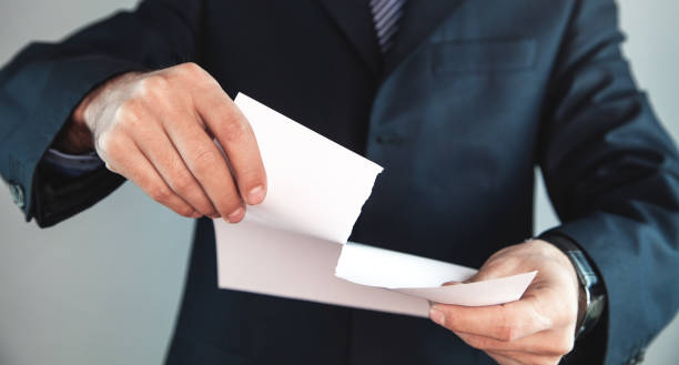 istock Businessman tearing white blank paper. 1128156256