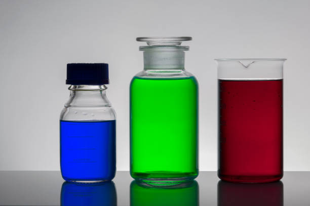 istock Liquid in laboratory bottles. Scientific biochemical laboratory. Colorful liquid. Isolated on white background,  a group of bottles. Test tubes. 1128156843
