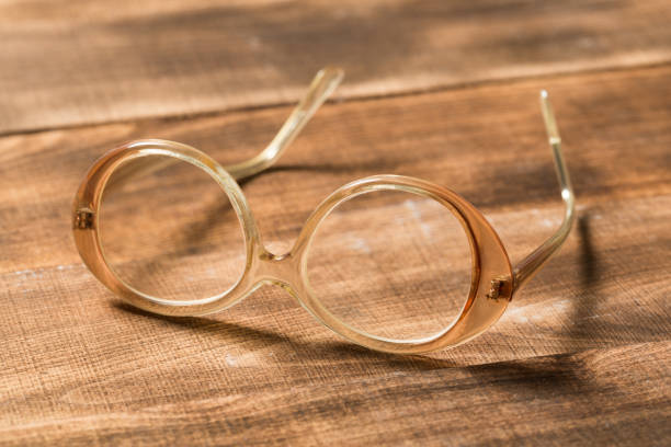 istock A pair of glasses on a wooden table 1128159608