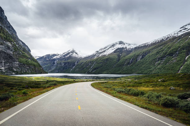 istock Winding mountain road without cars 1128162475