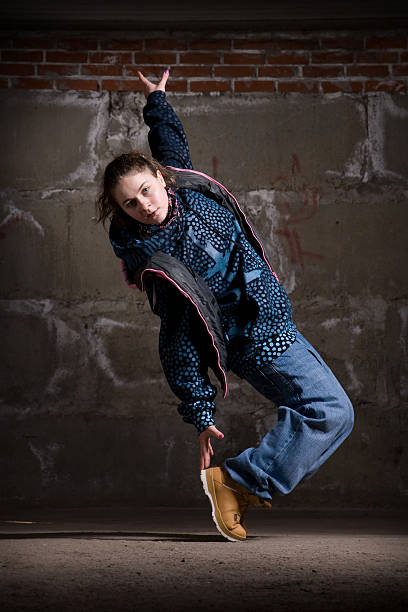 istock Hip hop dancer in modern style over brick wall 112816407