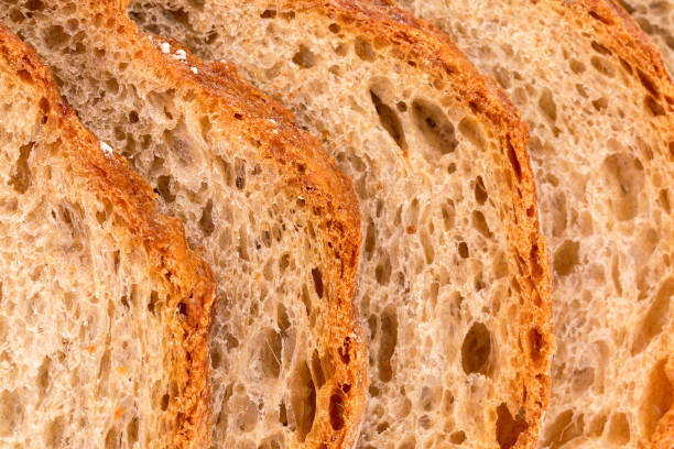 istock Slices of rye wheat bread, bread crust, close up 1128165132