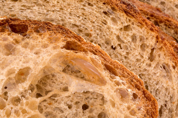 istock Slices of rye wheat bread, bread crust, close up 1128165143