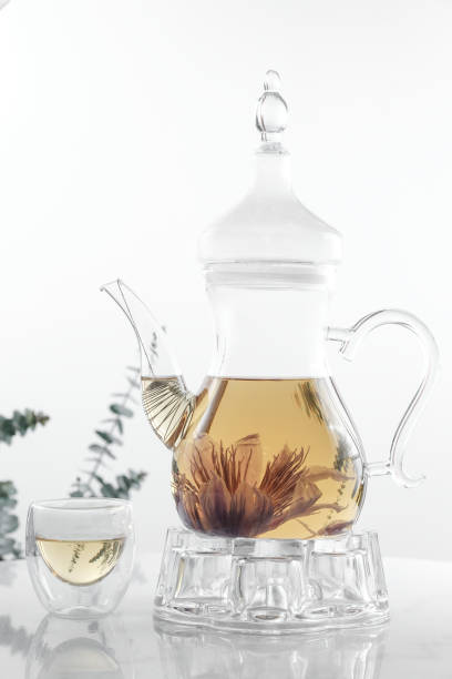 istock Hot flower tea in glass pot 1128168672