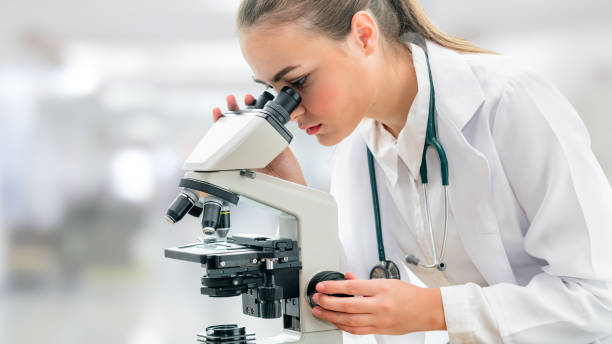 istock Scientist researcher using microscope in laboratory. Medical healthcare technology and pharmaceutical research and development concept. 1128168816