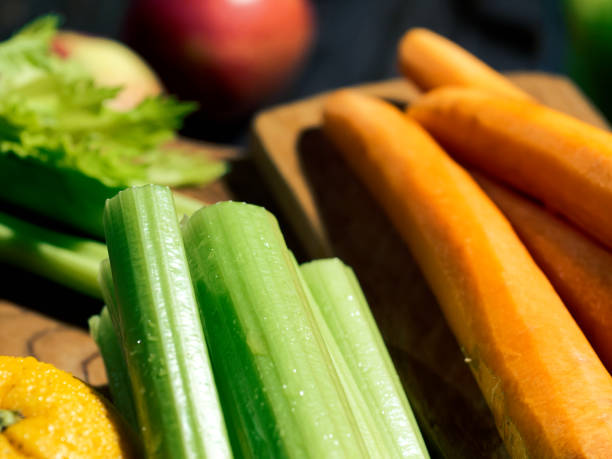 istock Celery, carrot and orange smoothie 1128170915
