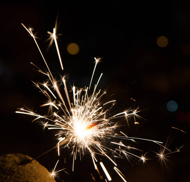 istock Bengal fire sparkles isolated on dark background 1128171023