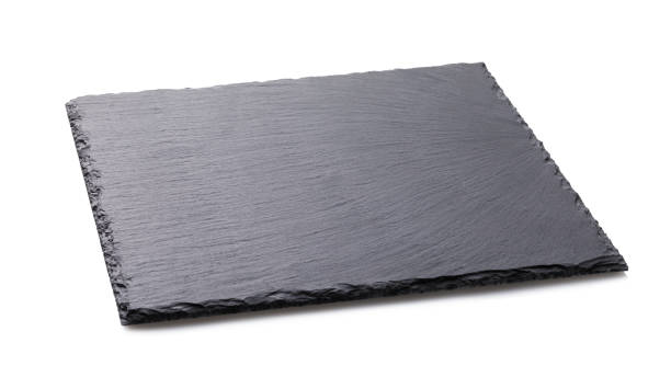 istock Black food slate stand isolated on white background 1128171177