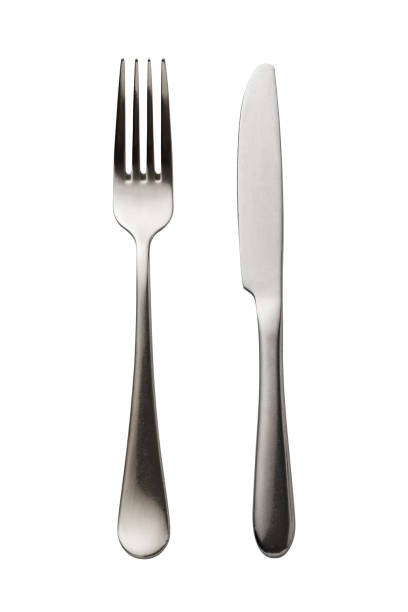 istock Fork and knife isolated on white background. Top view on cutlery 1128171222