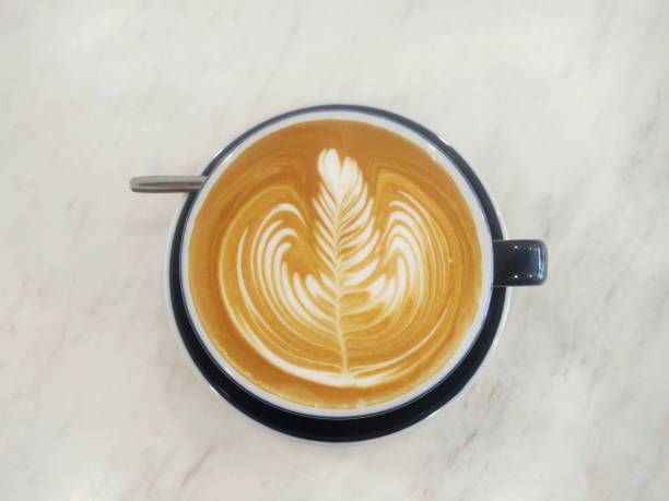 istock Cup of coffee with latte art - Rosetta. 1128171564