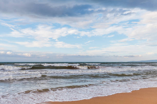 istock Calm waves on the beach. The storm is coming 1128172207