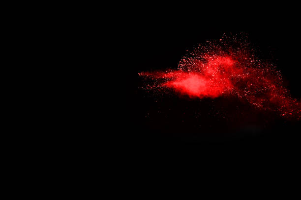 istock abstract red powder explosion on black background.abstract red powder splatted on black background. Freeze motion of red powder exploding. 1128177308
