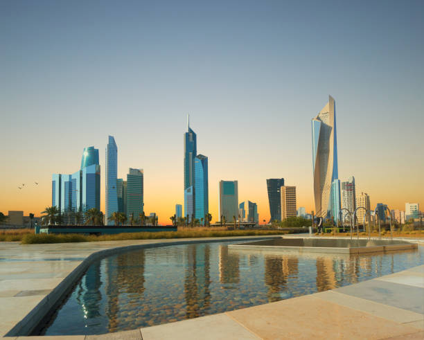 kuwait city skyscrapper view during sunset stock photo