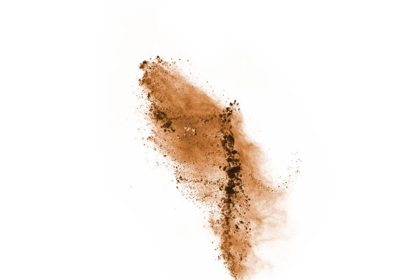 istock Brown color powder explosion on white background. Colored cloud. Colorful dust explode. Paint Holi. 1128177484