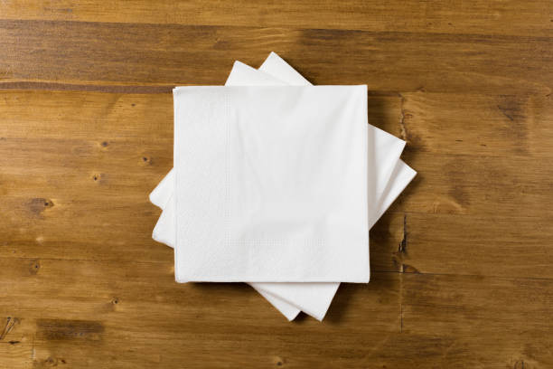 istock white paper napkin on wooden background 1128179667