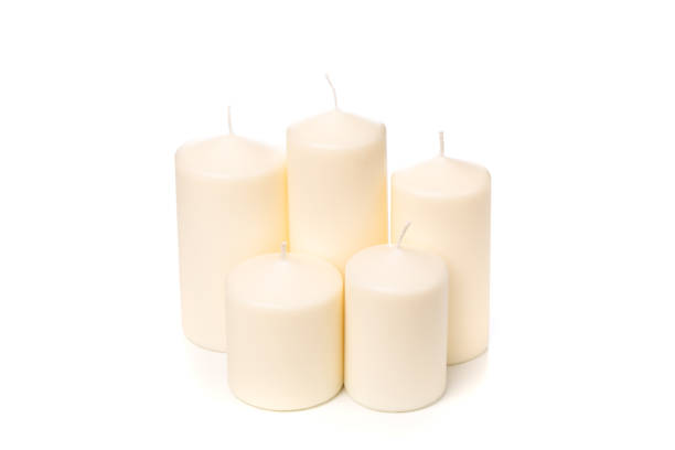 istock White candle on white background isolated. Set of wax candle. 1128181061
