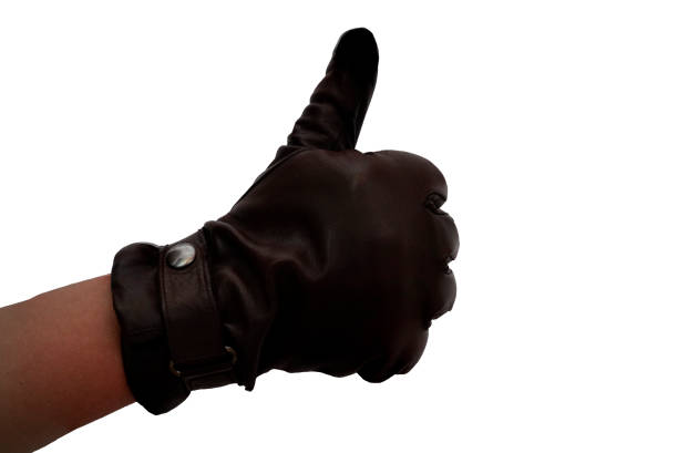 Hands of a man in leather gloves, using a smartphone. Touch leather gloves.