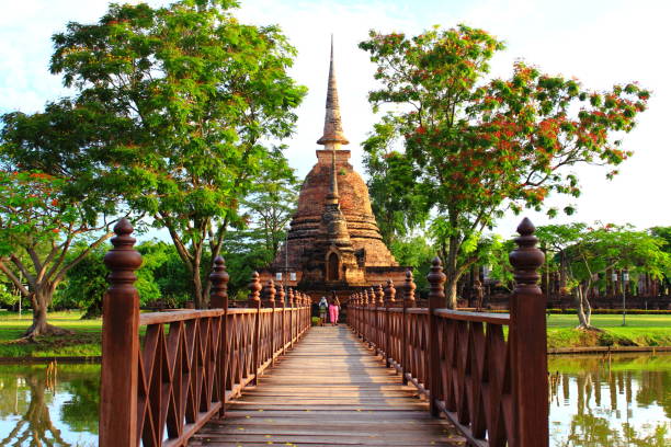 istock Wooden bridge to historic pagoda 1128184052