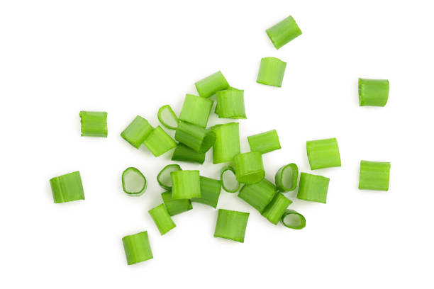istock Chopped fresh green onions isolated on white background. Top view 1128184538
