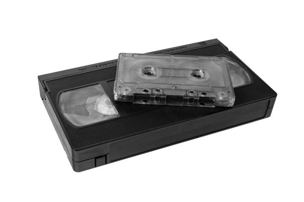 audio tape cassette and VHS video tape cassette on white background audio tape cassette and VHS video tape cassette on white background, isolated audio cassette blank vcr film reel stock pictures, royalty-free photos & images