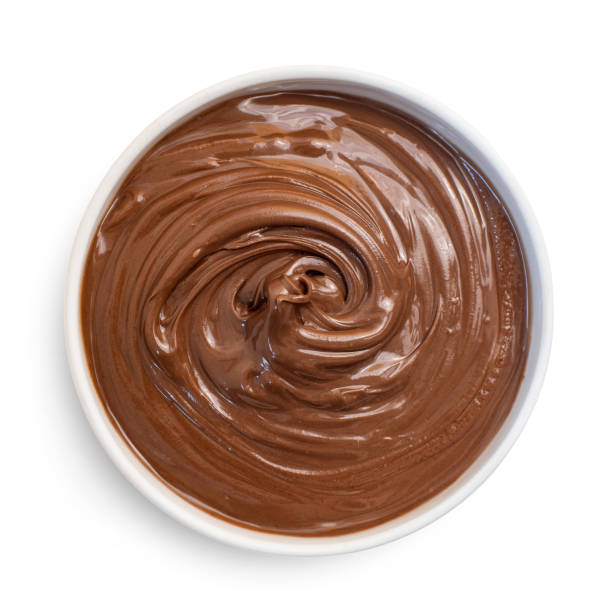 istock Chocolate hazelnut cream in white bowl, isolated on white. Top view 1128186873