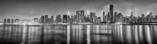 istock Black and white New York City panorama at night. 1128187409