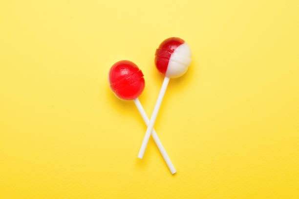 istock Lollipop on a yellow background. Space for text or design. 1128188869