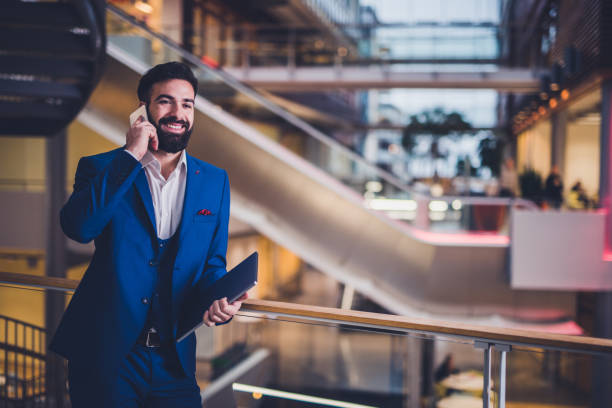 istock Young business man talking on the smart phone. 1128191035