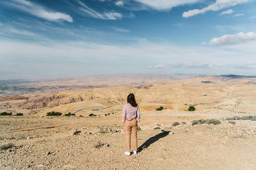 Young Caucasian woman looking at view from Mount Nebo