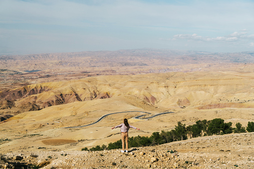 Young Caucasian woman looking at view from Mount Nebo