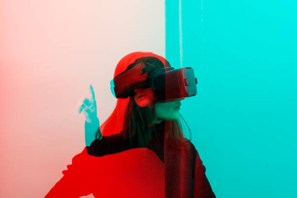 istock Woman wearing VR Glasses 1128192646