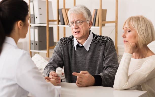 istock Nurse explaining pescription medicine to senior couple 1128192859