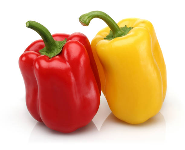istock Red and yellow bell peppers isolated 1128193111