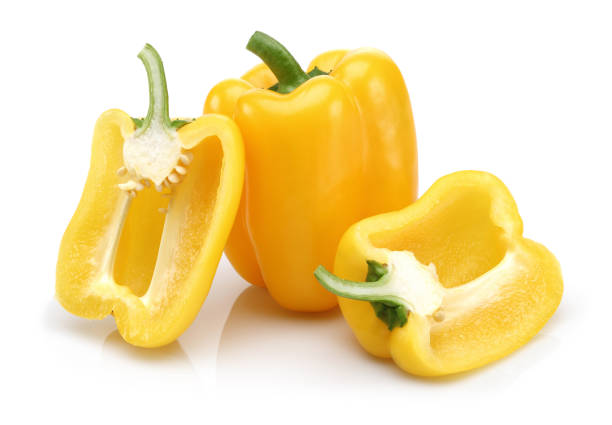 istock Whole and half yellow bell peppers isolated 1128193646