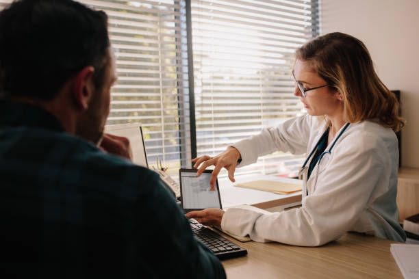 istock Doctor showing test results on tablet to her patient 1128194432