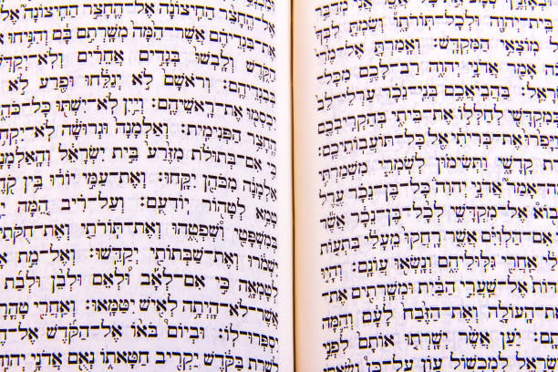 istock Opened hebrew Bible, isolated on white background 1128194872