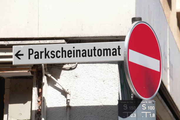 istock Street sign parking ticket machine 1128195222