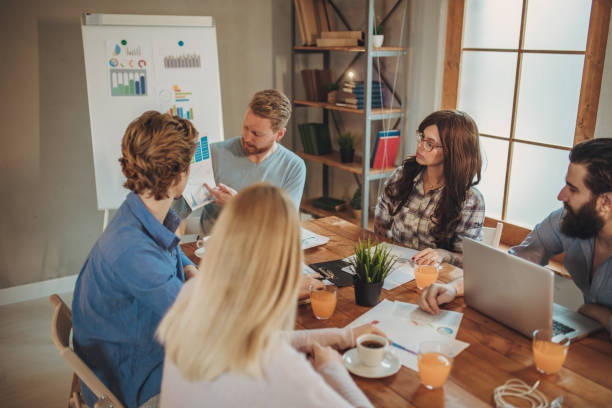 istock Young people brainstorming together in office 1128196005