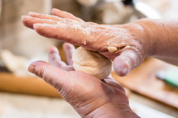 istock Chef pouring flour on wooden board.Selective focus. 1128196204