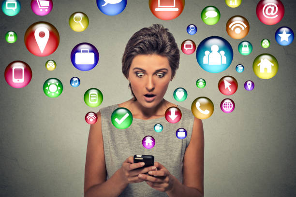 istock woman using texting on smartphone with social media application symbols 1128196354