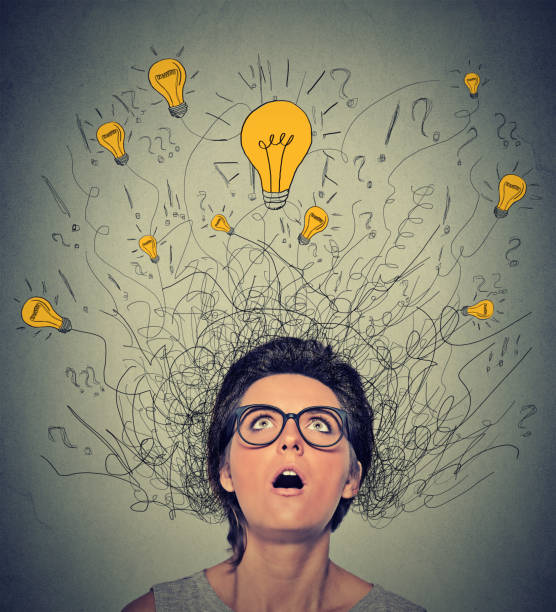 istock thinking woman with question signs and light idea bulb above head 1128196502