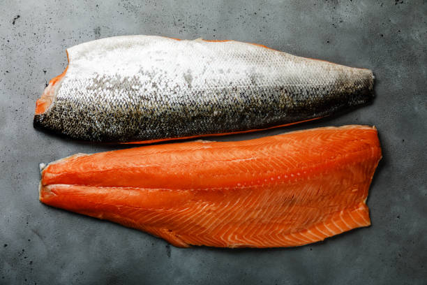 istock Fresh salmon fillet on concrete background 1128197711