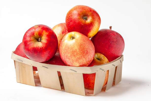 istock Dali apples in a basket on a white background 1128199005