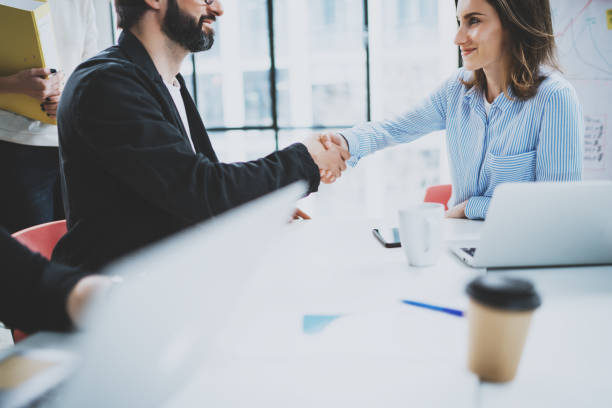 istock Business partnership handshake.Concept two coworkers handshaking process.Successful deal after great meeting.Blurred background. 1128203121